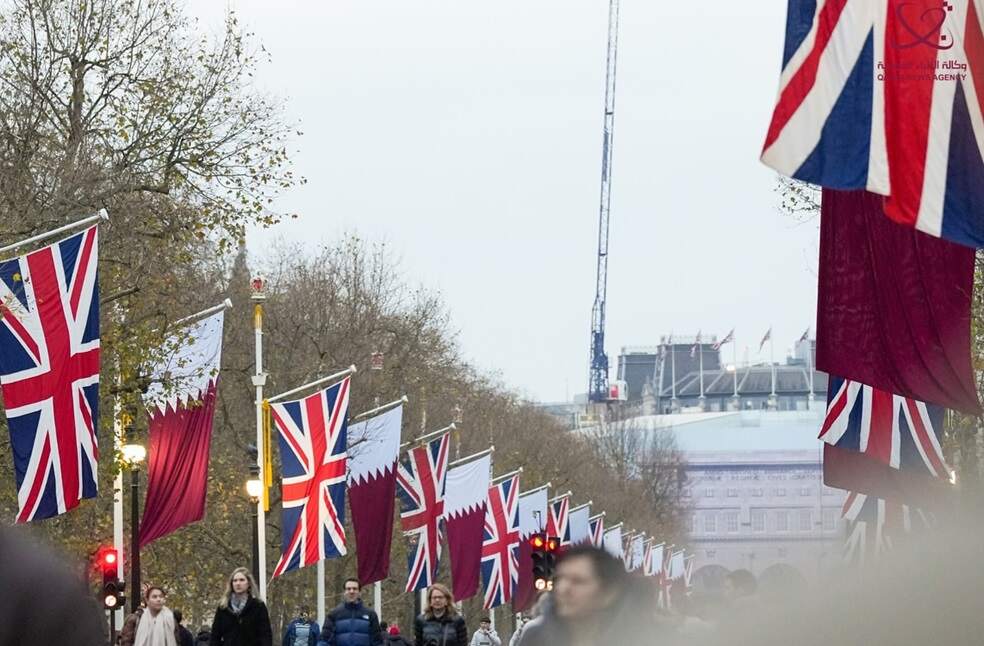 Uk and Qatar flags in streets