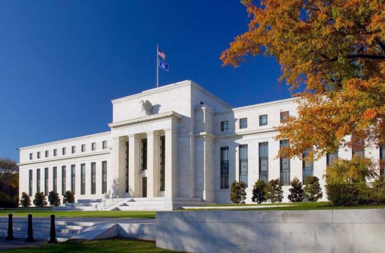 Fed cuts growth forecast