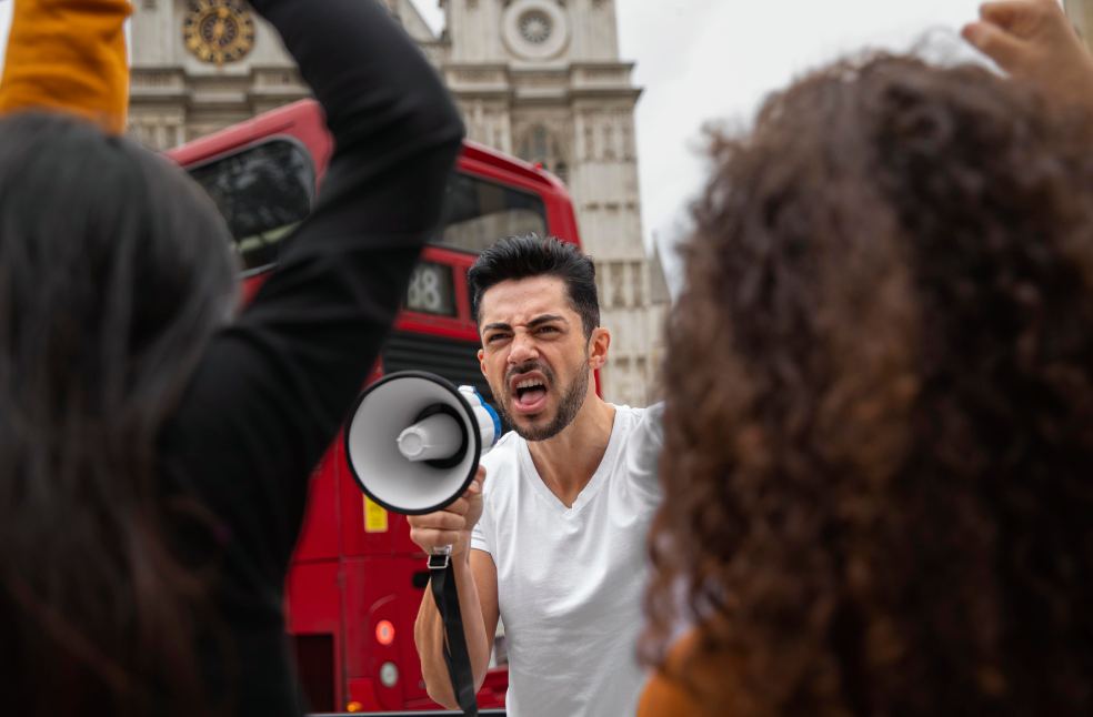Close up angry man at protest