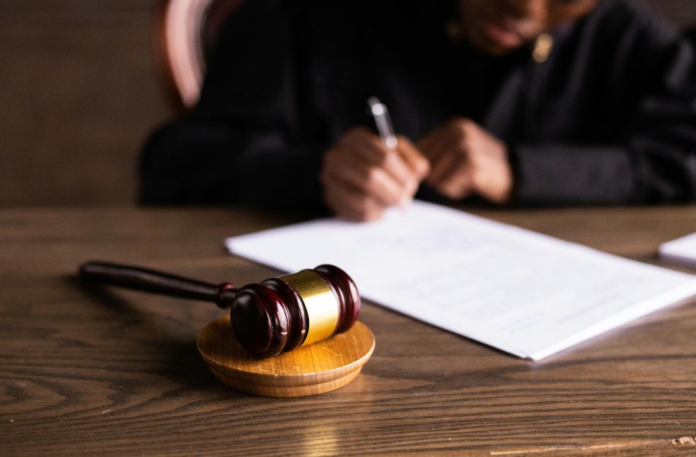 Judge Signing on the Papers