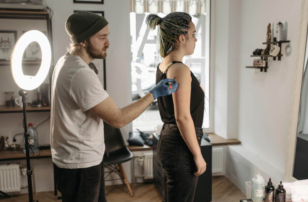 Man Drawing on Woman's Arm