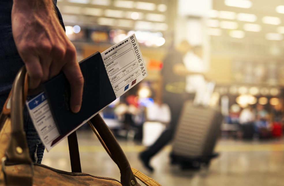 Traveler with boarding pass for a direct flight