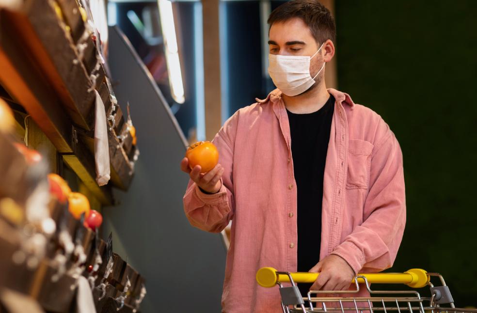 Front view man holding fruit