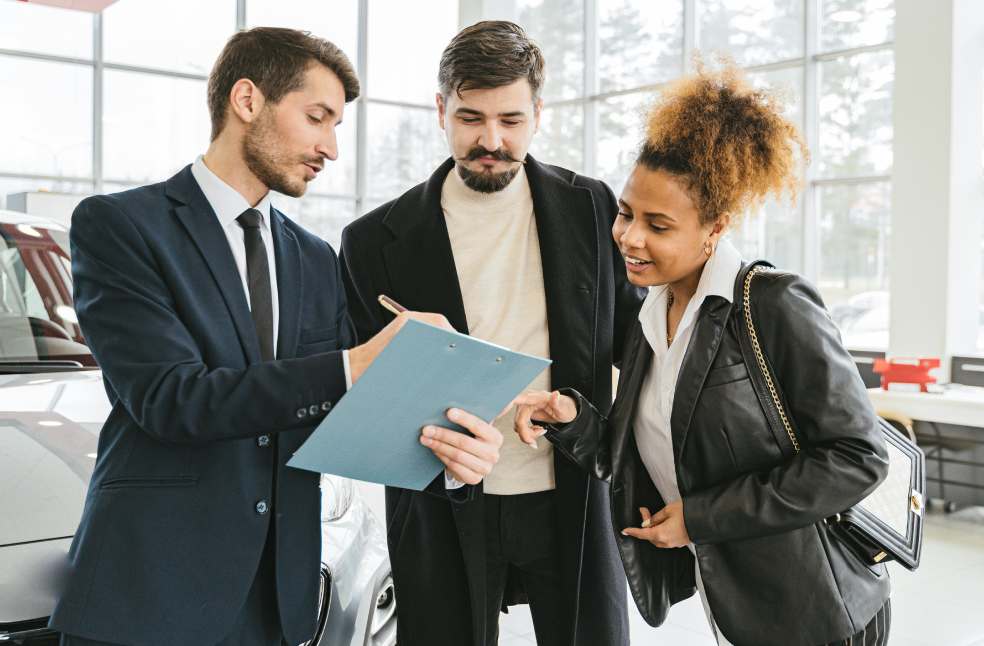 People Looking at a Blue Folder