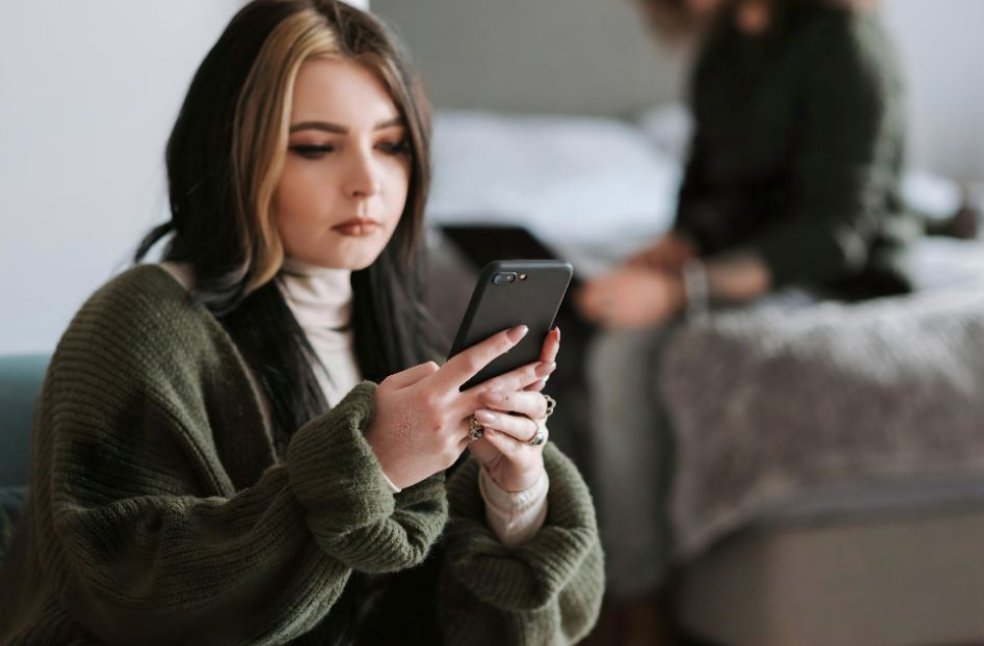 Women lookin at social media