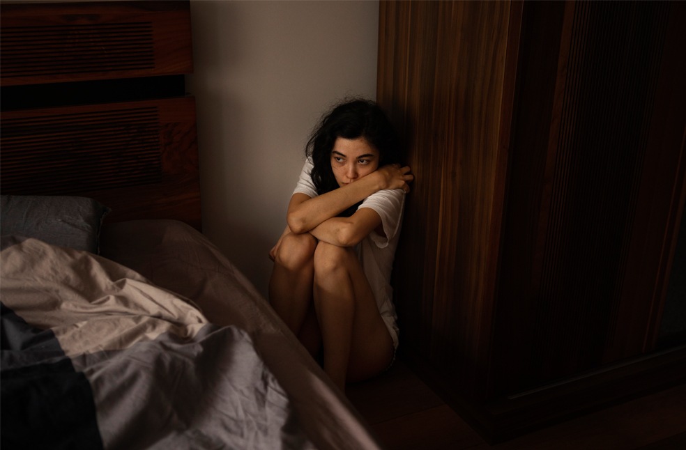 A teen in her room feeling scared