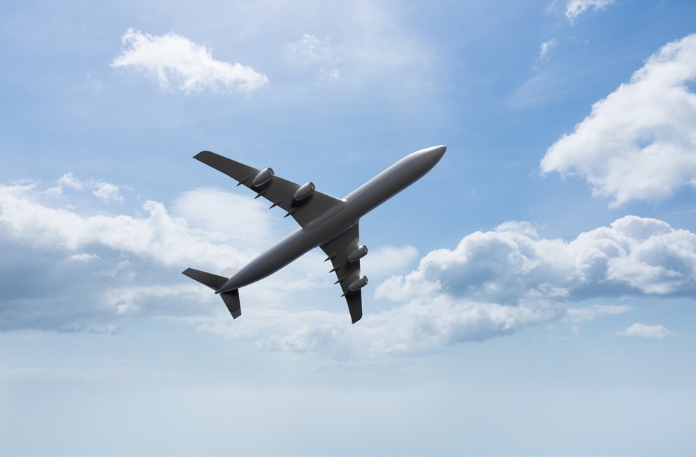 Bottom view of a plane in the sky