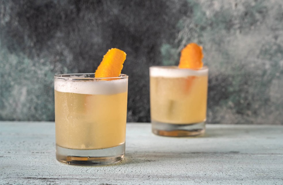 2 glasses of cocktail kept on a table