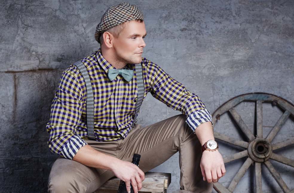 Handsome guy in checkered shirt with blue bow tie