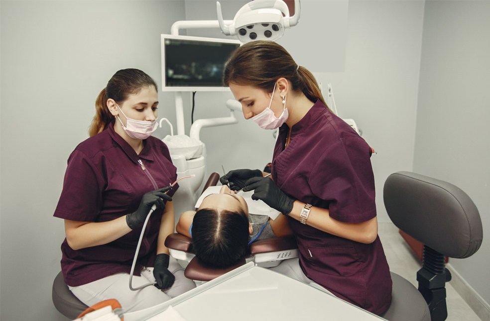 two female doctors checking on a patient