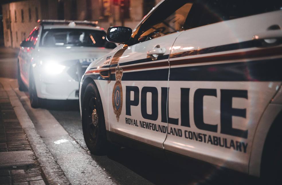 Police Cars Parked on Street Sidewalk
