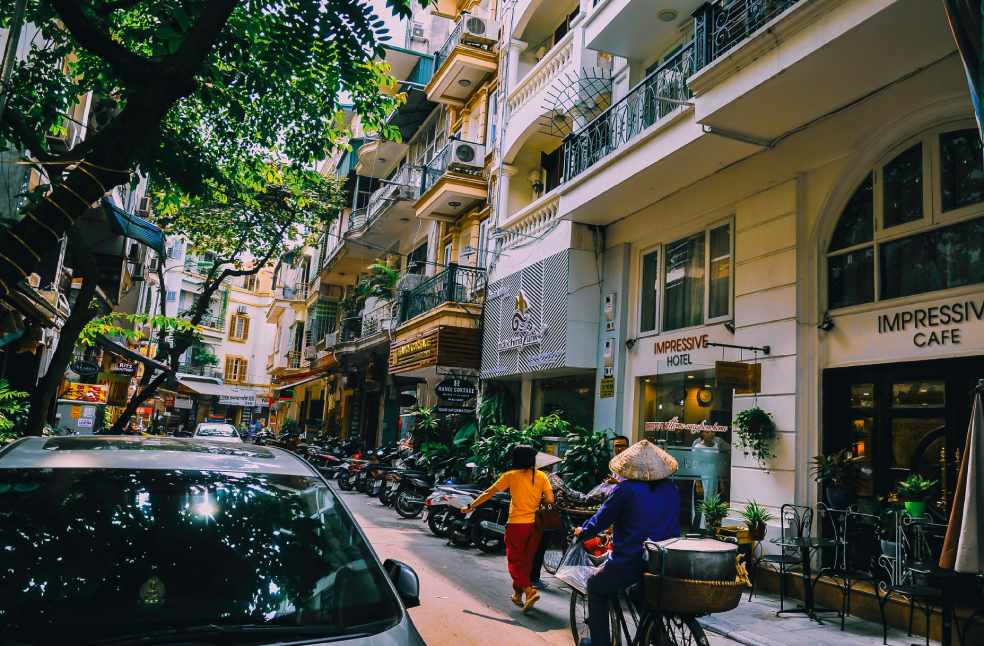People Walking in Front of Buildings in Vietnam