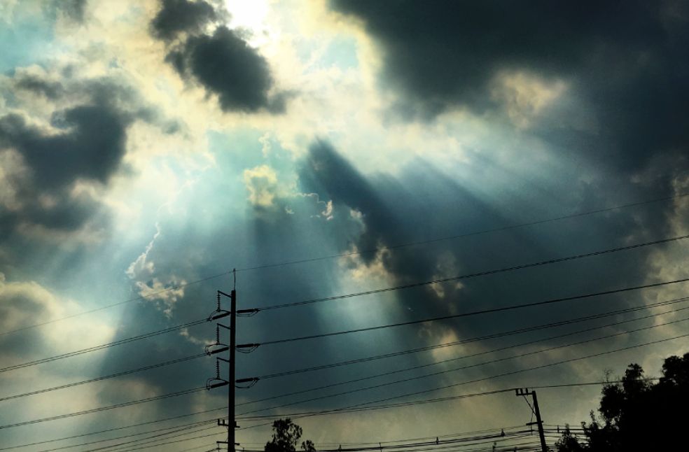 Cloudy sky with sunbeam