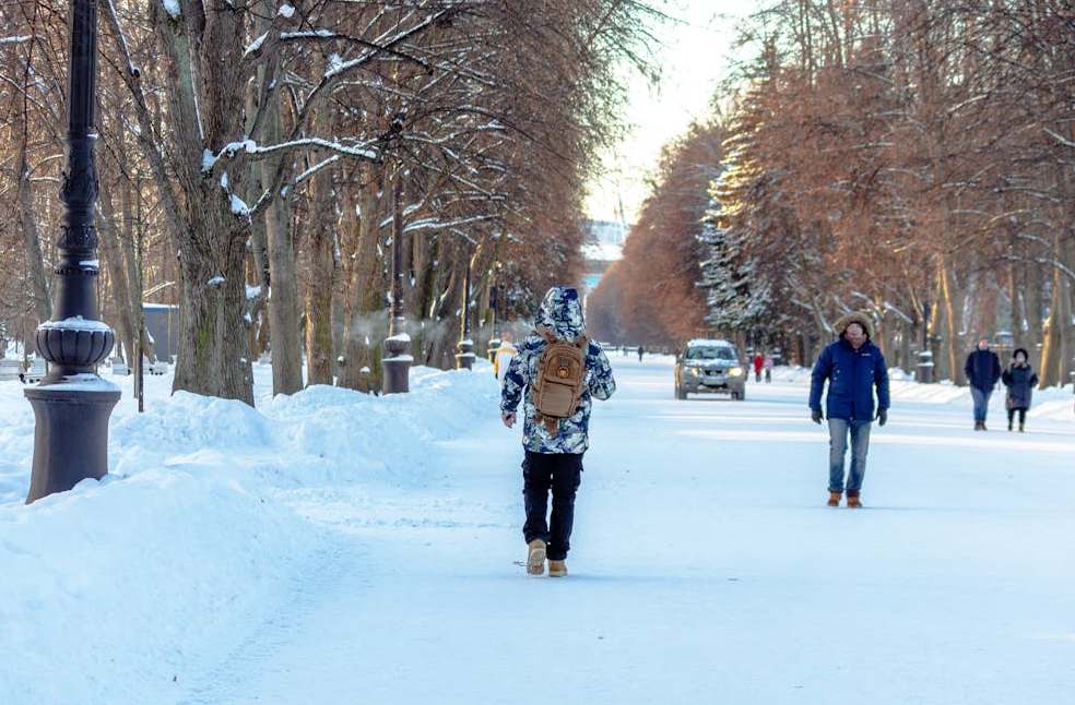 People walking in streets covered with snow