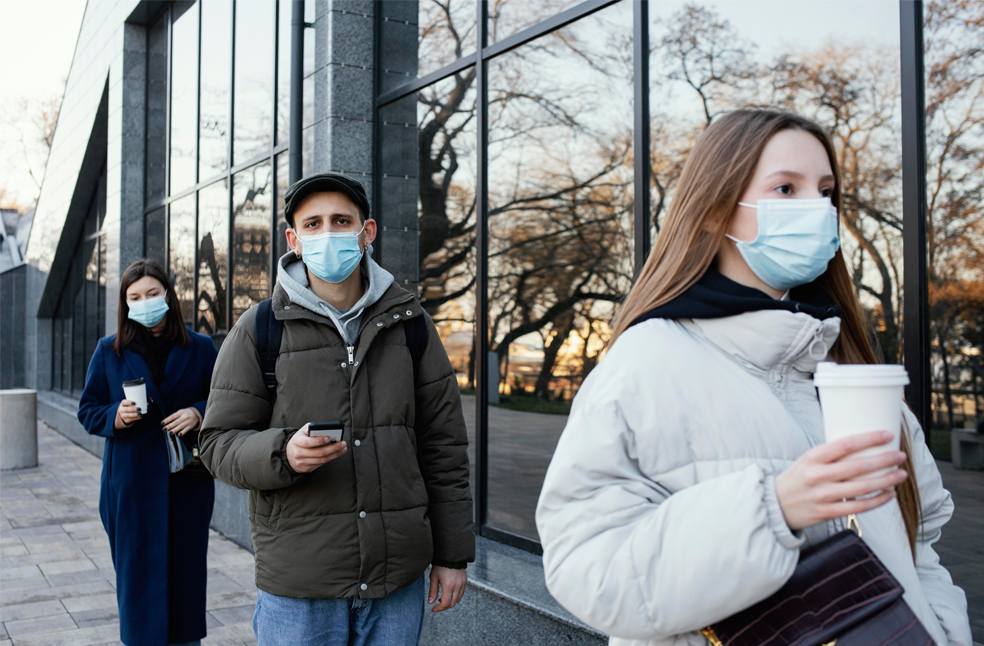 People wearing mask waiting in line