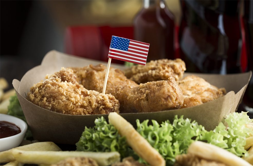 Fried chicken and French fries with a US Flag