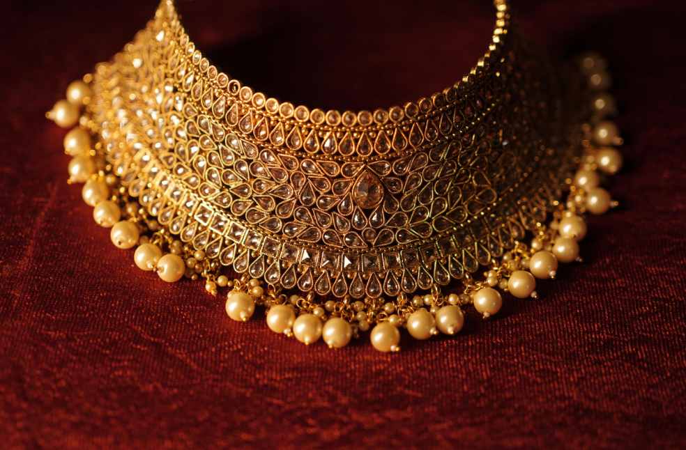 Intricate Gold Necklace with Pearl Accents