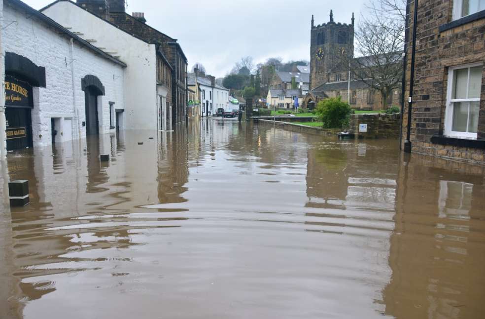 Submerged neighbourhood streets and houses amid New Zealand floods