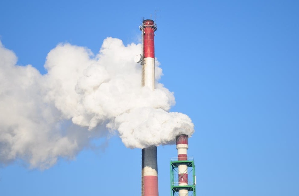 Smoke Stacks Against Blue Sky