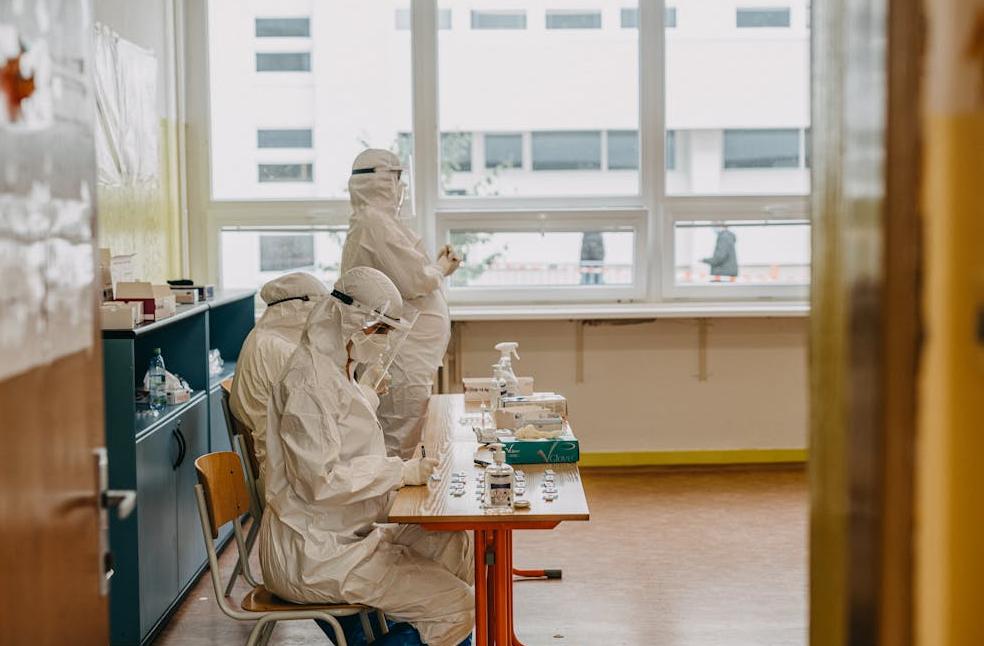 Medical professionals in PPE working in a health facility amidst the pandemic