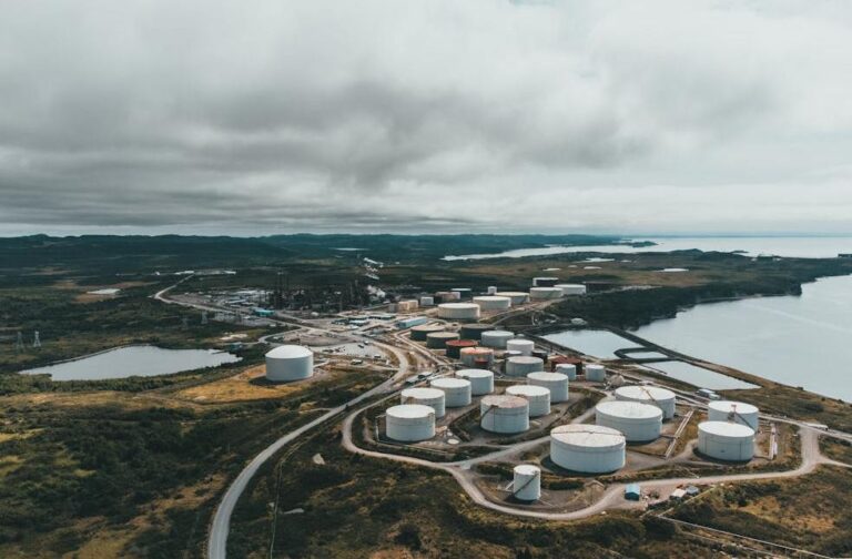 Global energy crisis exposes weak oil reserves in poor nations Aerial landscape shot of a coastal oil refinery