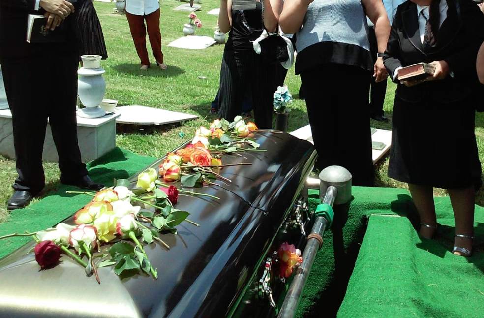 group of people attending burial