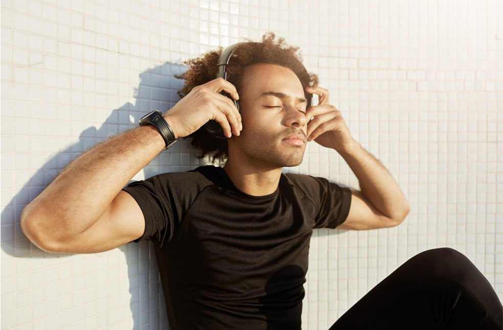 A man relaxing, listening to music