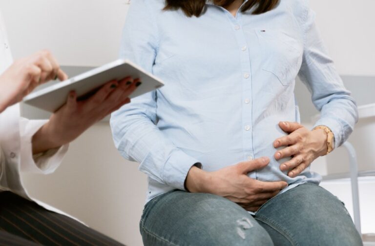 Walking and bending at work during pregnancy linked to miscarriage risk Pregnant woman attending a healthcare consultation