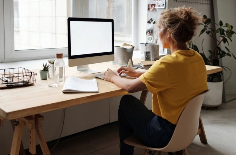 Study links sitting over 30 minutes to cancer deaths A woman working on her computer in a bright, modern home office setting