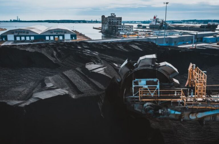 China generates less than half its electricity from coal Aerial view of a coal industry yard with machinery in Baltimore harbor