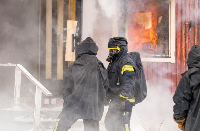 Thailand investigates negligence after Bangkok bar blaze kills 30 Firefighters extinguishing a blaze