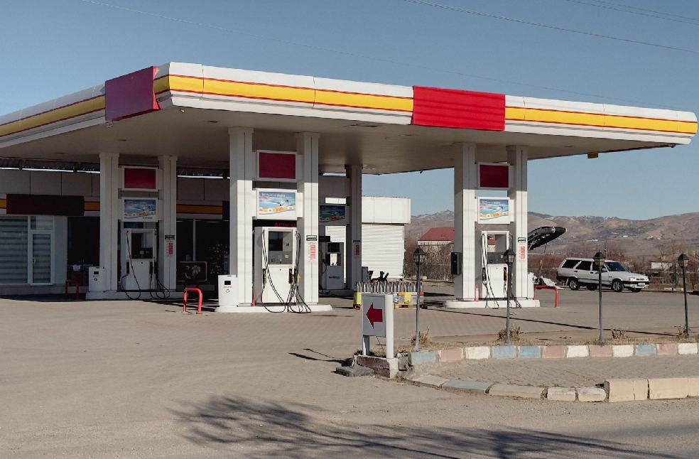 Daytime view of a petrol station in Kovancılar, Elazığ, with clear blue skies.