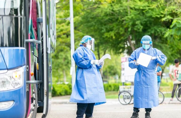 NHS lacked enough PPE during Covid, inquiry finds Healthcare workers in PPE managing COVID-19 checkpoint outdoors during pandemic