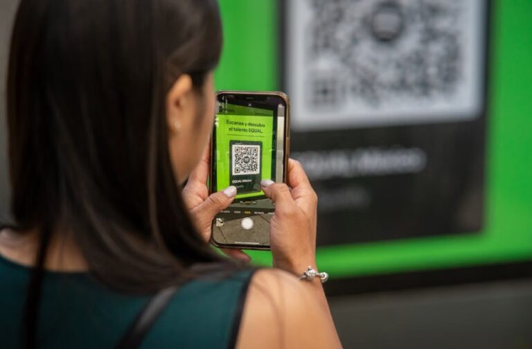 Behind QR code: Unseen cyber risks of everyday scanning A woman uses her smartphone to scan a QR code