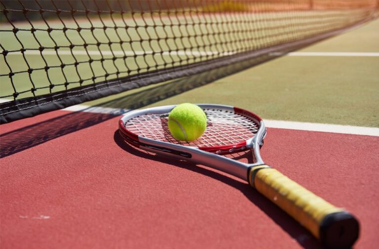 WTA sets new eligibility rules with one-time gene test A tennis racket and new tennis ball