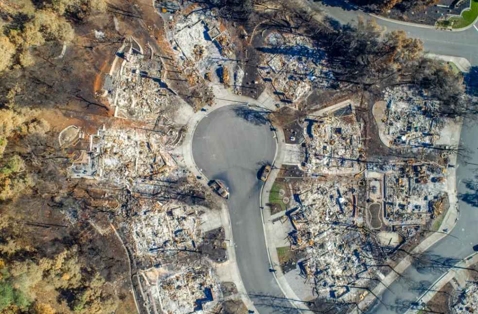 Aerial view of Santa Rosa neighborhood devastated by Wildfire. Burned homes visible.