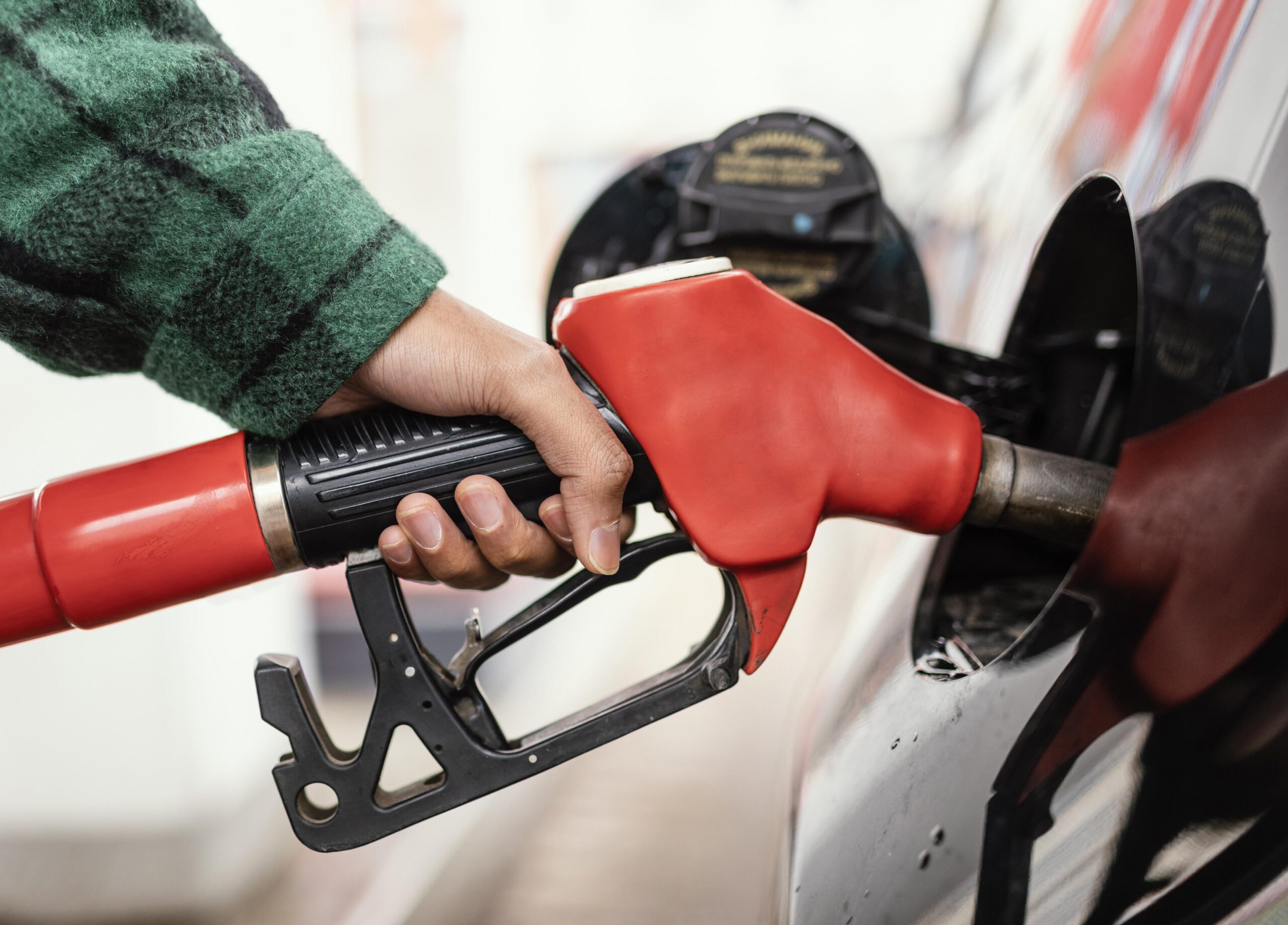 Man at gas station with the car close up