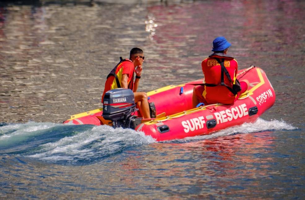 Lifeguards on a rescue boat patrolling the waters