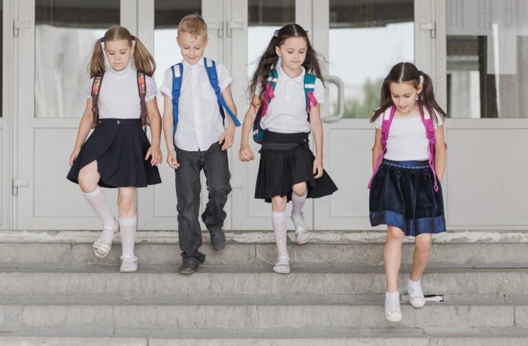 Parents divided as new school uniform rules take effect Kids in school uniform at school