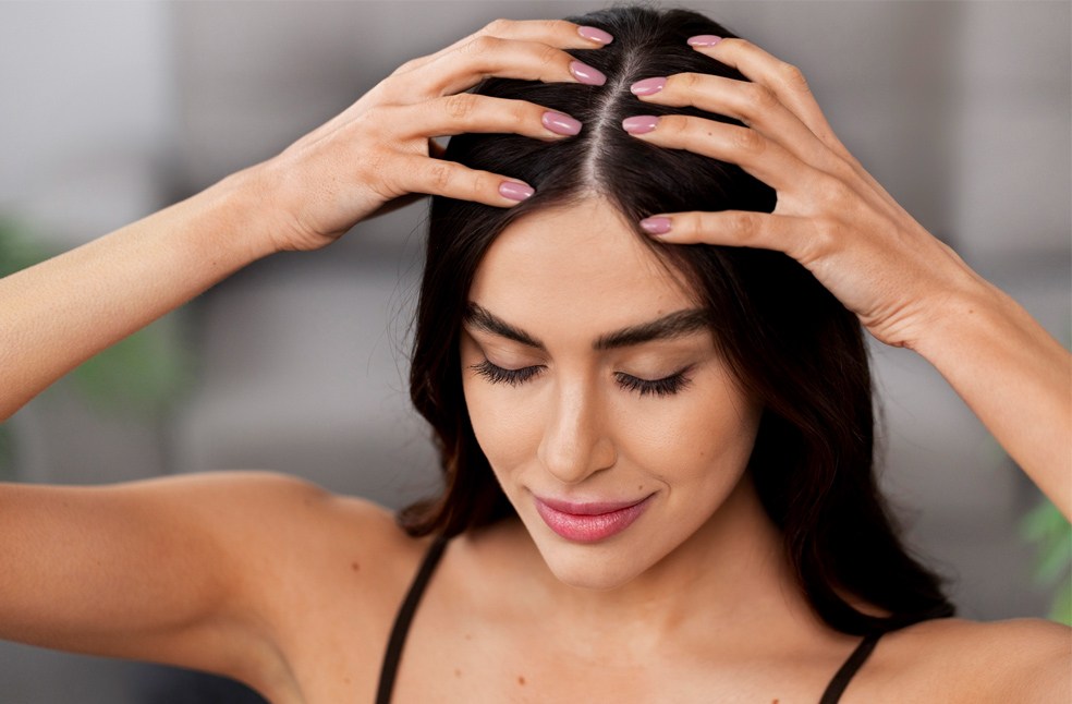 A woman checking her scalp