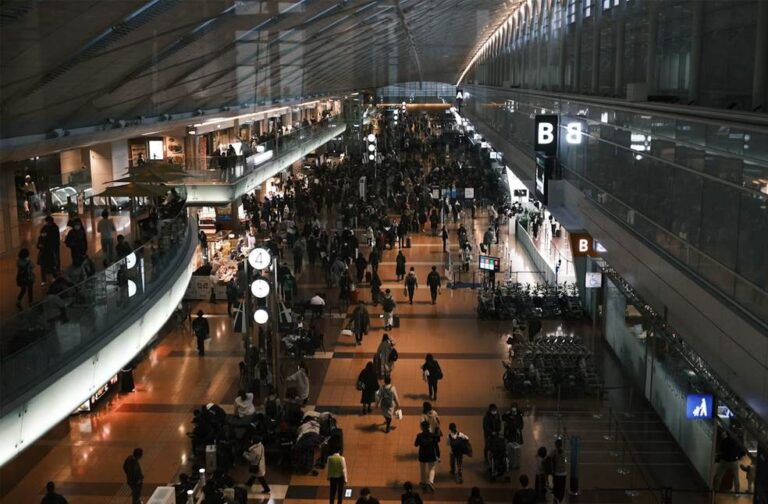 Japan floods leave thousands stranded at Narita Airport Travellers at a busy airport