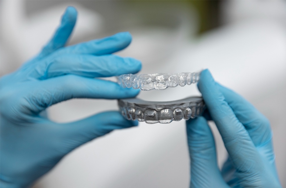 Dentist holding a night-time mouthguard