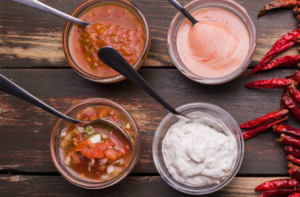 Different types of dips set on a table