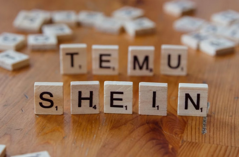 Scrabble letters spelling out the words Temu and Shein