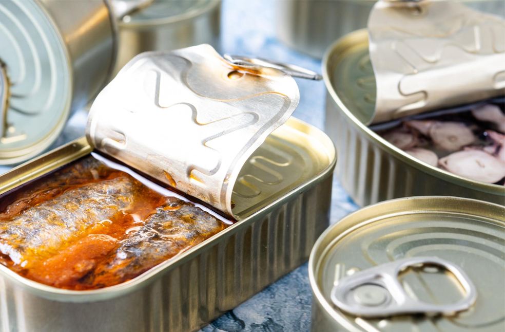 Canned fish opened at a table