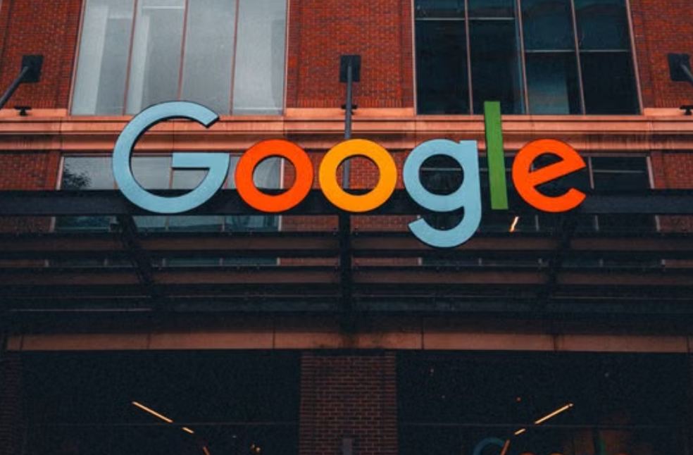 Colorful Google logo on modern building exterior in urban environment