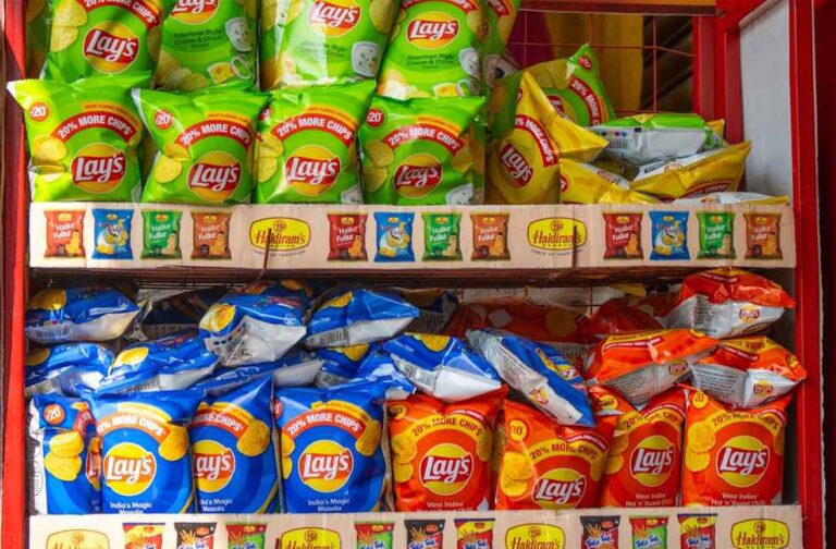 India moves closer to restricting HFSS foods near schools Lays packets arranged in a store