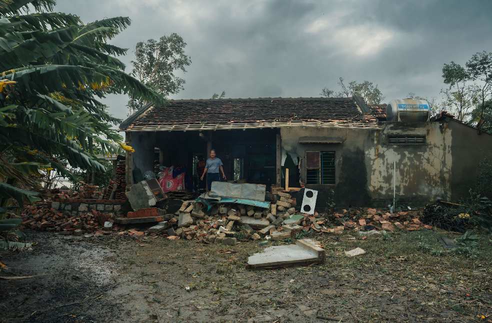 A rural house in Phú Yên, Vietnam, heavily damaged by a storm, showcasing nature's impact