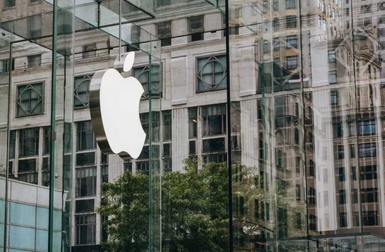 OpenAI hits back at Apple over trade-secret theft allegations Apple logo on a modern glass facade with urban reflection