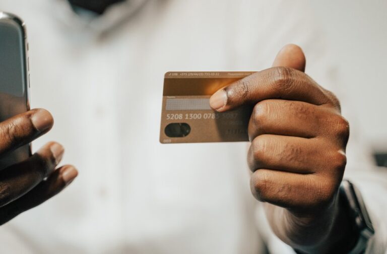 Smart Giving: Technology brings charity closer to all Person using a smartphone and credit card for online payment